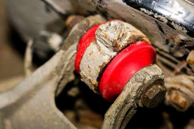 greased suspension bushing slip risk
